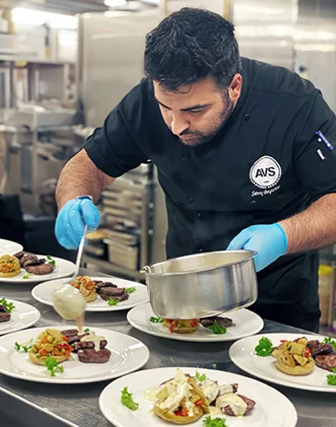 An AVS chef who prepares meals for the ship's crew